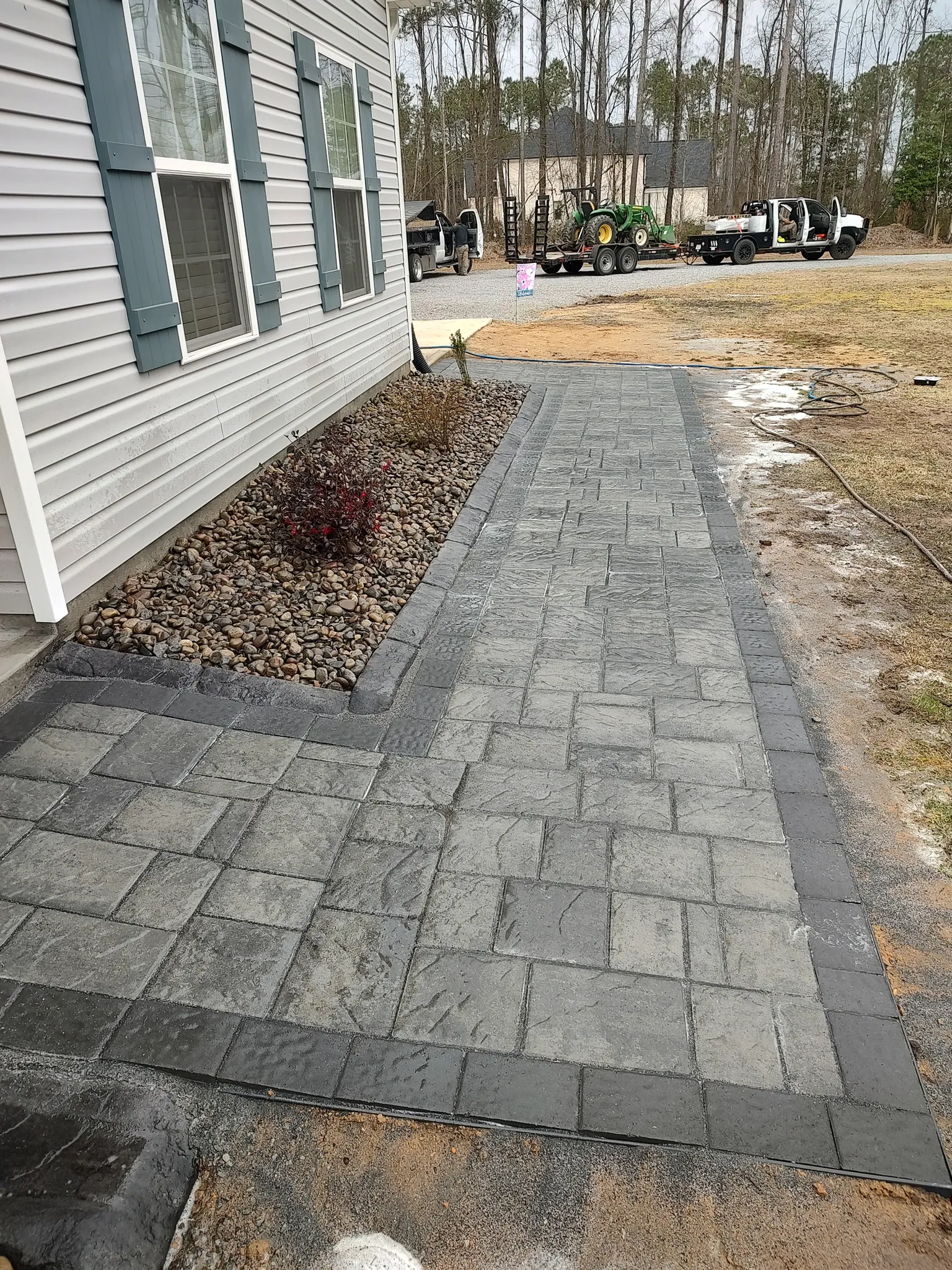 Square flagstone stepping path in a landscaped yard