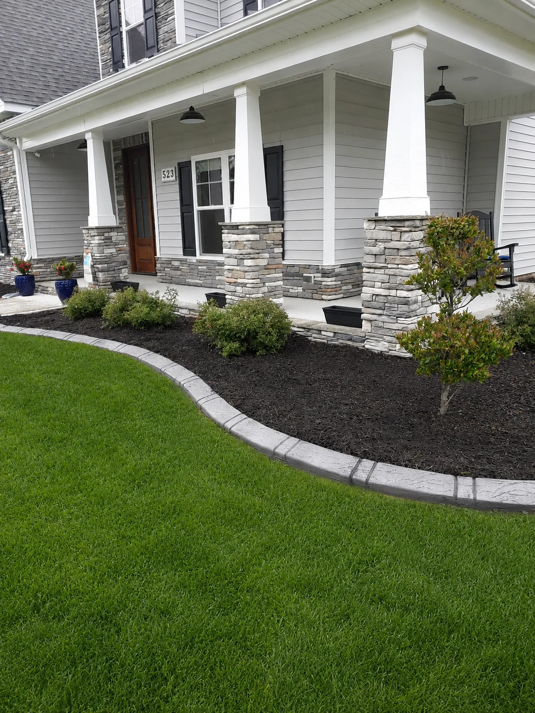 Concrete curbing installation with drainage control by Landscaping Plus LLC